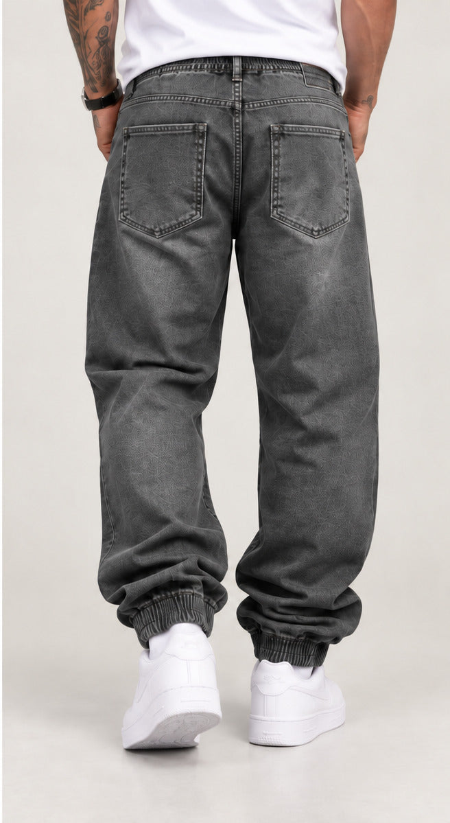 Pantalón baggy puño ancho hombre gris trasera
